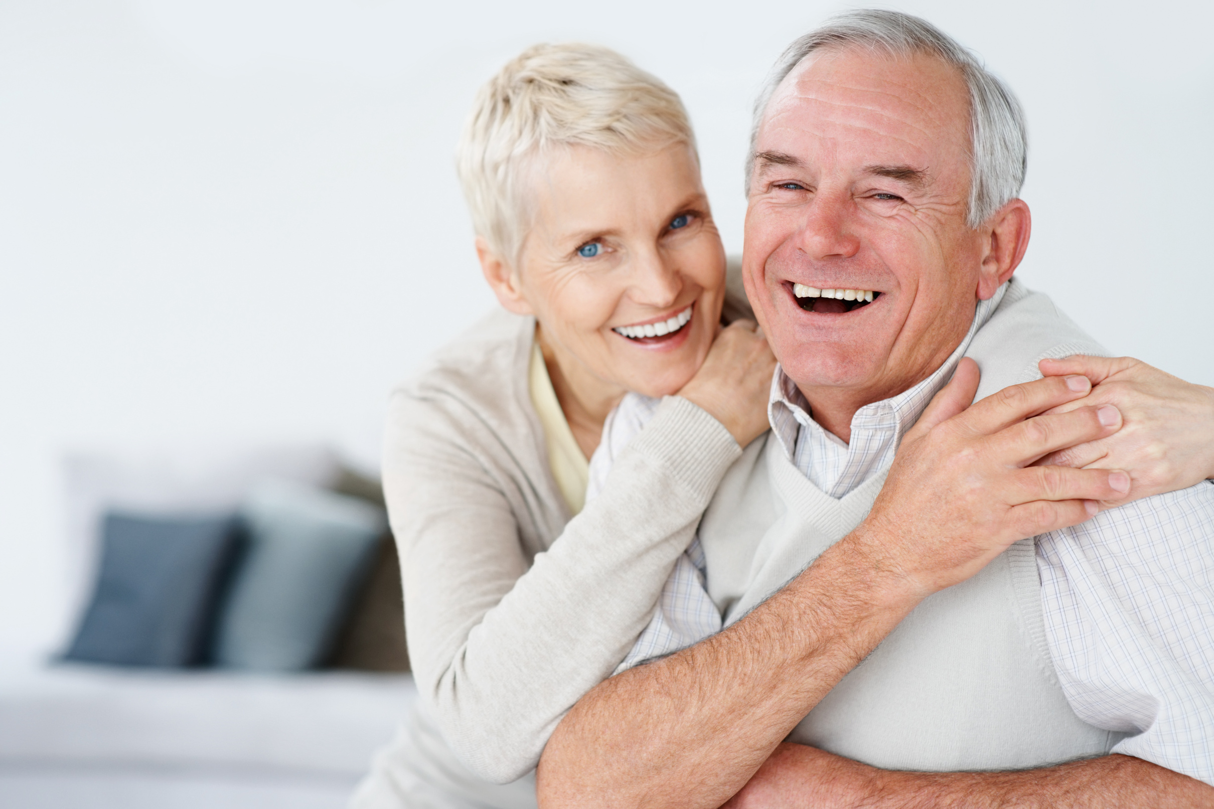 Retired elderly couple smiling together